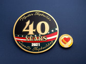 Ingalls 40 Years Display Coin Beside Small Coin