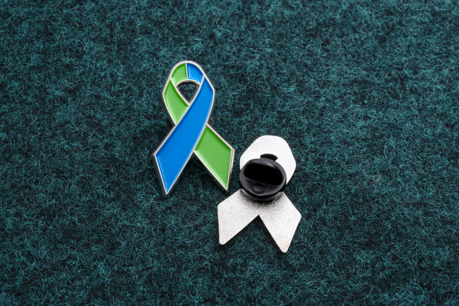 Black rubber clutch backing on a lapel pin