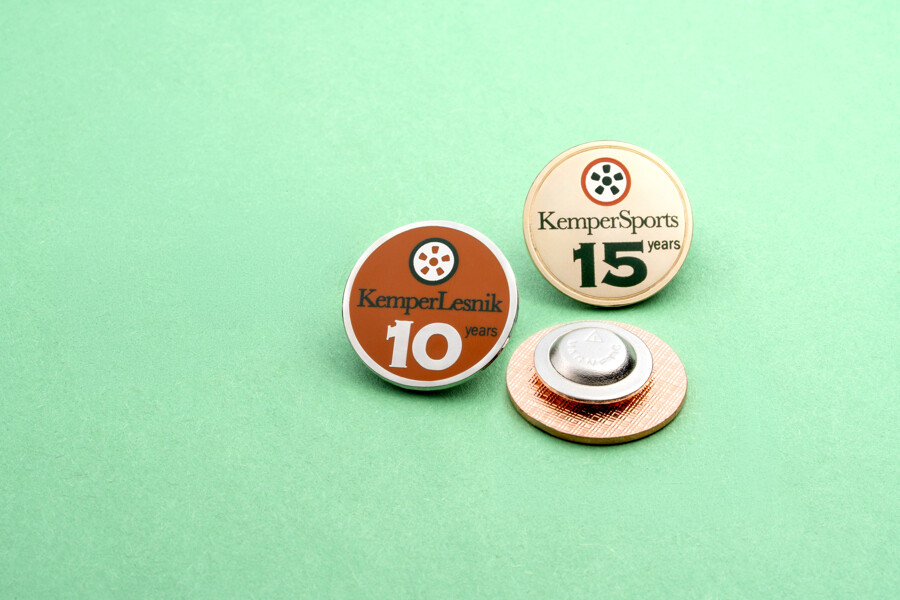 Magnetic backing on a lapel pin