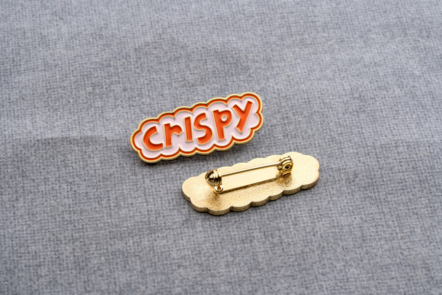 Safety pin backing on a lapel pin